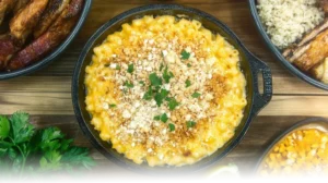 Golden smoked mac and cheese topped with parsley and panko breadcrumbs, served in a cast iron skillet.